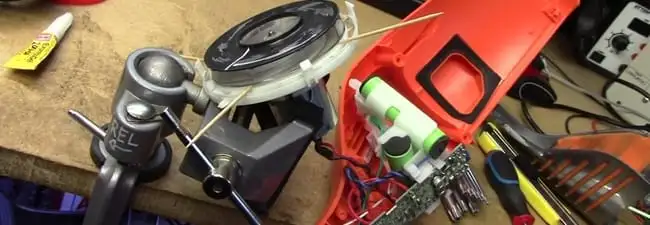 Vacuum cleaner repair parts and tools on a workbench in Columbia, SC